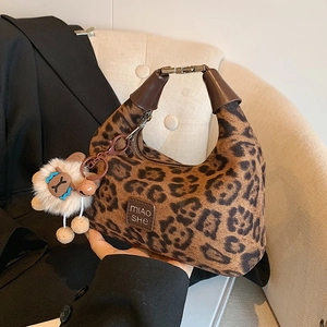 Leopard print handbag detail with leather handle, MIAOSHE label and plush sheep charm