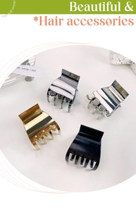 Close-up of small alloy hair claws in gold silver gunmetal and shiny black finish