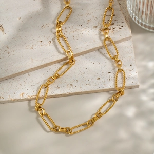 Minimalist 18K gold plated stainless steel textured chain necklace on beige stones
