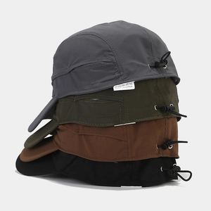 Stack of 5-panel quick-dry baseball caps in grey, green, brown, and black colors
