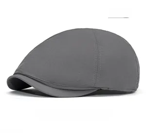 Detail of dark gray quick-dry flat cap with breathable texture and neat stitching