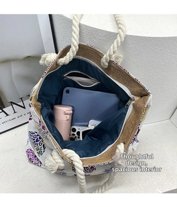 Spacious tote bag interior view with blue lining and storage for everyday essentials