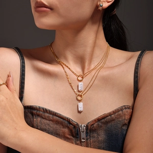 Double-layered 18k gold plated necklace featuring baroque rectangle pearl pendants