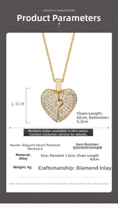 Golden heart pendant necklace with rhinestones showing chain length and pendant size