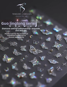 Close-up of 3D holographic butterfly nail stickers with delicate rhinestone and pearl accents
