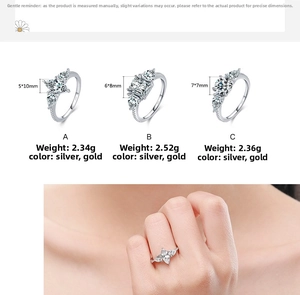 Detail view of S925 silver rings with assorted zircon shapes and gold-tone finish