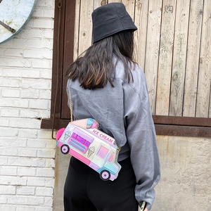 Close-up of laser ice cream truck crossbody bag with chain strap on a model