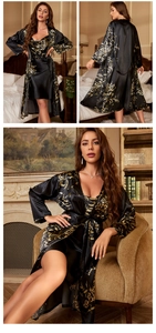 Detail of silk satin nightgown set featuring black fabric with gold floral print patterns