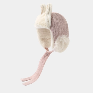 Detailed view of children's pink winter hat with rabbit ears and plush lining