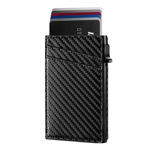 Detail of carbon fiber card wallet featuring a pop-up mechanism and multiple card slots