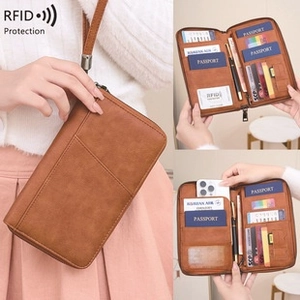 Detail view of RFID blocking leather passport holder with multi-slot storage and wrist strap