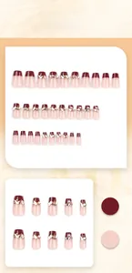 Detail of short French burgundy press-on nails with sparkling champagne glitter and pearls