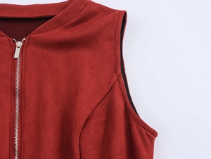 Detailed macro view of the silver metal zipper on wine red sleeveless top with suede texture