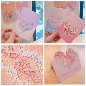 Detail showing 3D embossed floral heart greeting cards with Best Wishes text