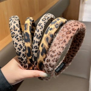 Set of five leopard print hairbands featuring plush and fabric textures for women