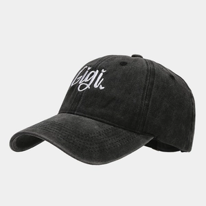 Detailed view of Gigi embroidery on a vintage washed cotton baseball cap in dark grey