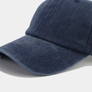 Detailed macro view of dark blue washed cotton fabric with six-line reinforced stitching