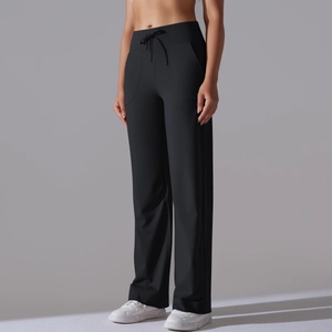 Detail of high waist drawstring on black wide-leg yoga pants with side pockets