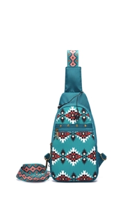 Detail of bohemian sling bag with tribal patterns and colorful wide shoulder strap