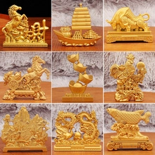 Macro detail of various vintage gold brass zodiac and feng shui lucky charm statues