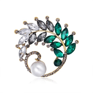 Macro detail of alloy brooch with multi-color crystals and a large white pearl flower