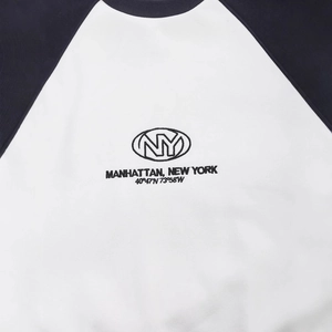 Women's black and white raglan sweatshirt featuring embroidered NY Manhattan typography