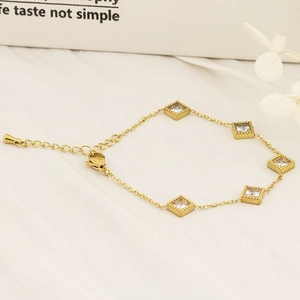 Detail of 18K gold plated bracelet with five square emerald-cut cubic zirconia stones
