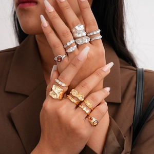 Retro set of 7 gold and silver rings with lava texture and rhinestones for women