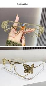 Detail of gold metal butterfly frames with sparkling crystals and anti-blue light lenses