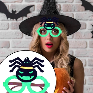 Detail of Halloween glow party glasses featuring neon spider and pumpkin character frames
