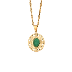 Vintage gold twist chain necklace featuring a geometric emerald green stone pendant