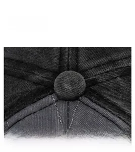 Macro shot of cotton twill texture and precision stitching on the black baseball cap crown