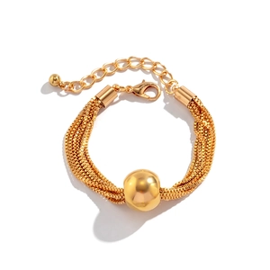 Detail view of multi-layer gold chain bracelet with a large spherical metallic bead