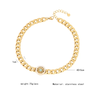 Detailed view of chunky stainless steel gold chain with green stone pendant and measurements