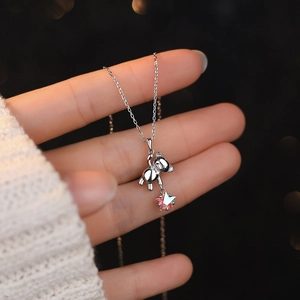 S925 sterling silver bear necklace with a sparkling pink star gem held by the bear