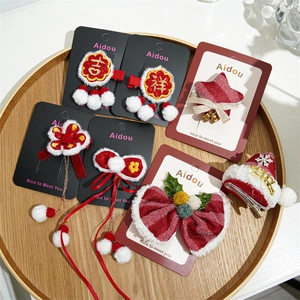 Festive red velvet bow and star hair clip set for Christmas and New Year celebrations