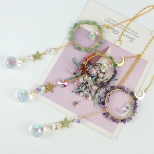 Three gold suncatchers with moon and star charms featuring crystal stone chips and glass balls