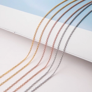 Detail view of four minimalist S925 sterling silver chains in gold, rose gold and silver finish