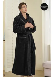 Detail of premium black coral fleece bathrobe with white piping and textured finish