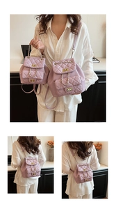Detailed comparison of large and small purple quilted leather backpacks with gold chain straps