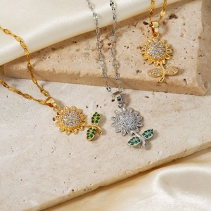 Elegant gold and silver sunflower necklaces featuring sparkling cubic zirconia stones
