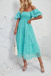 Detail of off-shoulder tiered blue plaid dress with smocked bodice and puff sleeves