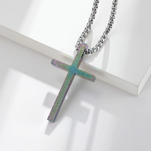 Minimalist matte cross pendant necklace with iridescent teal finish and square box chain