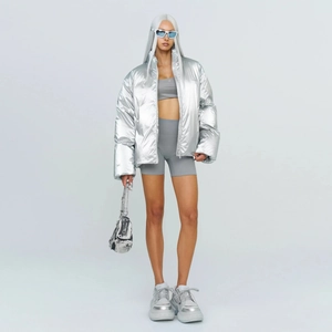 Futuristic metallic silver puffer jacket with oversized fit and high stand-up collar