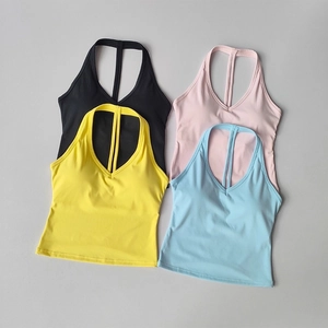 Soutiens-gorge de sport colorés en noir, rose, jaune et bleu posés à plat à col en V