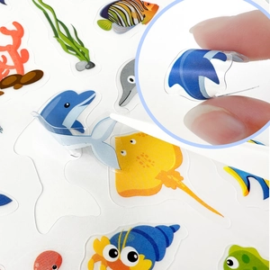 Detail showing transparent waterproof sea animal stickers with a dolphin and stingray