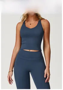 Detailed model shot of the badge blue yoga set featuring cross back vest and leggings