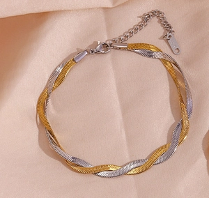 Detail of 18K gold and silver two-tone braided twisted chain with lobster clasp