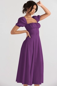 Detail of elegant puff sleeves and ruched square neckline on a purple summer dress