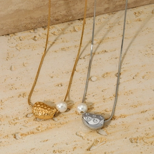 Minimalist 316 stainless steel pod pendants in gold and silver with pearl accents